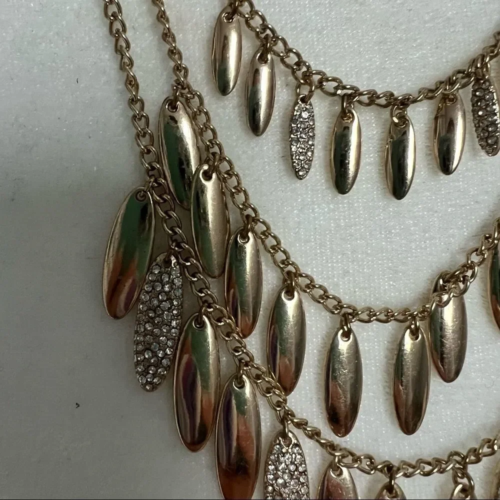 Triple strand gold and rhinestone studded petal necklace